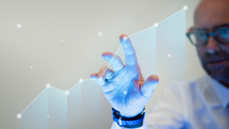 1644849937 businessman pointing his finger to growth graph 1644849937 businessman pointing his finger to growth graph
