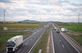 ep archivo   varios camiones circulan cerca de una gasolinera situada en el eje
