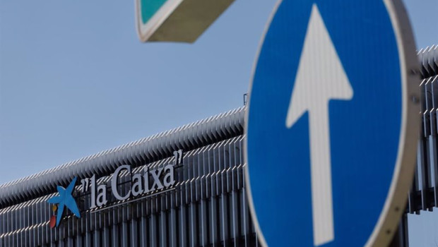 ep archivo   una senal del trafico frente a la fachada del edificio de caixabank en madrid espana