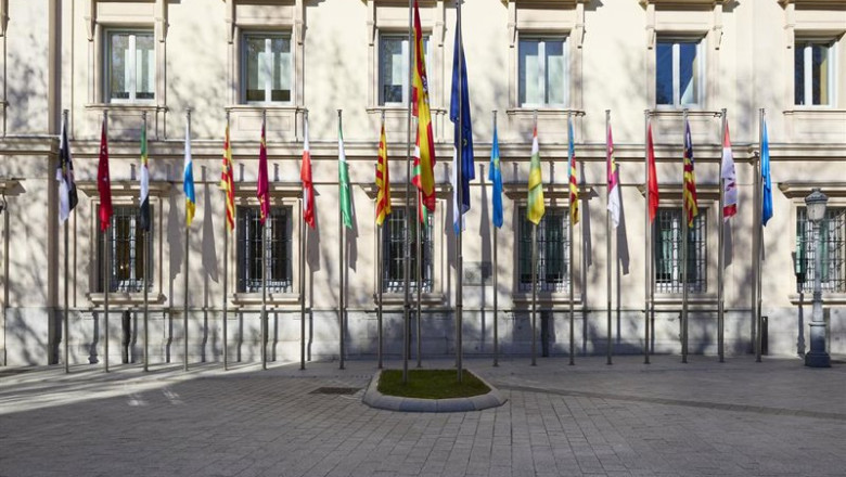 ep archivo   banderas de las comunidades autonomas frente a la fachada del palacio del senado