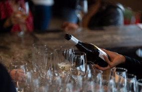 ep archivo   un camarero sirve copas de vino blanco en un bar 21 de febrero de 2024 en barcelona
