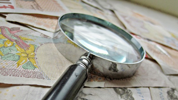 money pound sterling magnifying glass