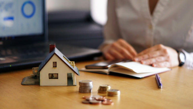 closeup shot person thinking buying selling house 