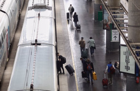 ep archivo   viajeros con maletas suben a un tren en la estacion puerta de atocha a 13 de abril de