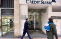 ep archivo   dos hombres pasan junto a la entrada de la sede de credit suisse en madrid espana