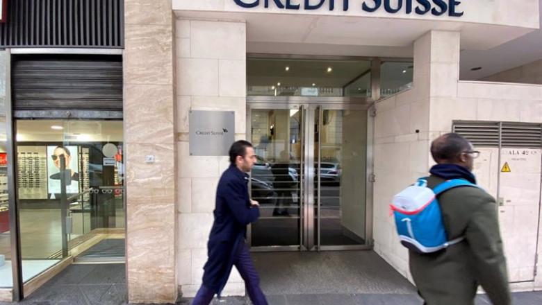 ep archivo   dos hombres pasan junto a la entrada de la sede de credit suisse en madrid espana