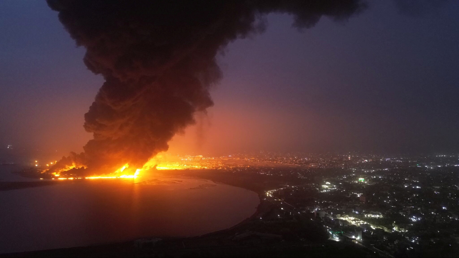 smoke rises from the site of israeli air strikes at the port of hodeidah 