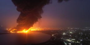 smoke rises from the site of israeli air strikes at the port of hodeidah 